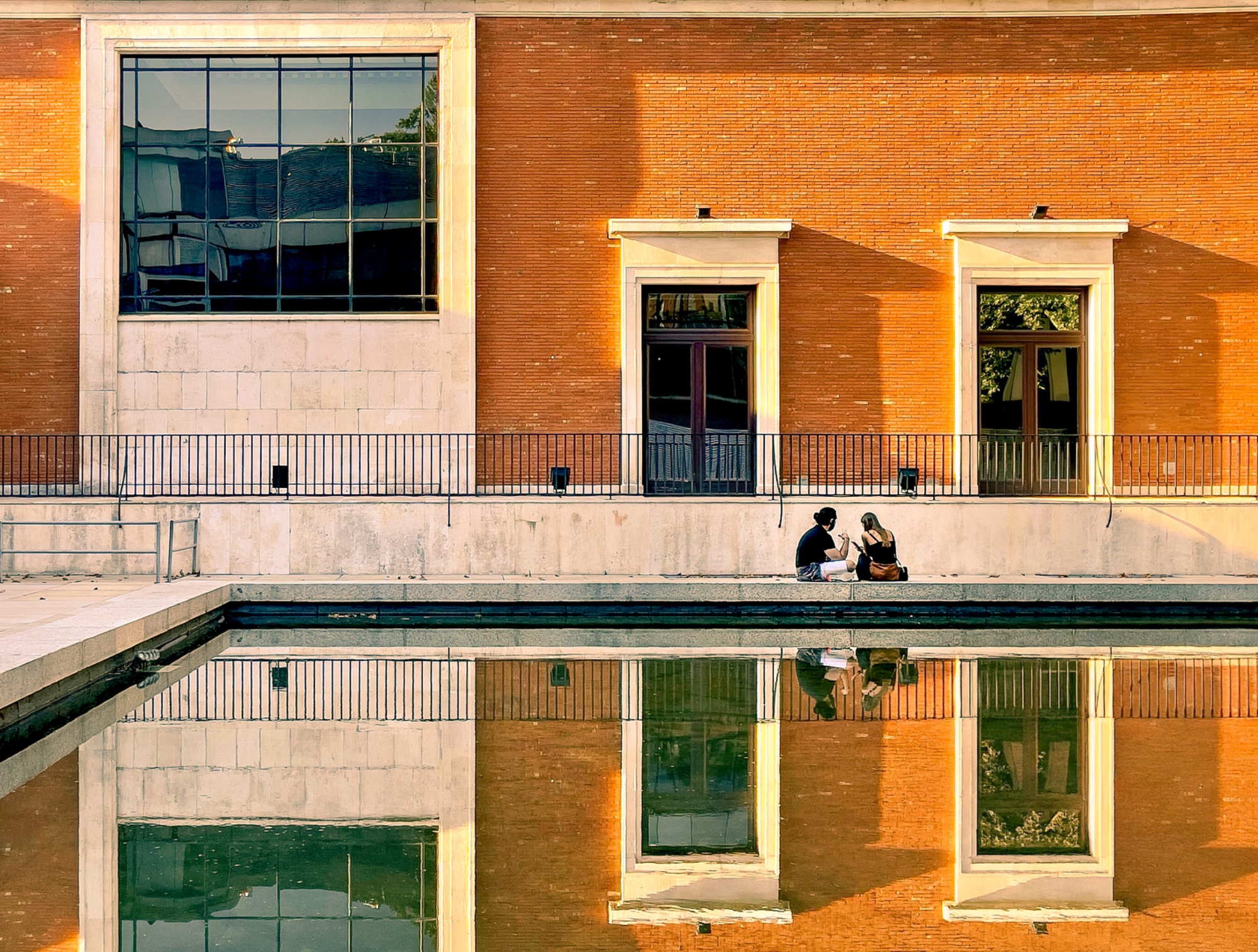 Symmetry in Sun and Stone — street photo by Les Zackler, scored 7.3/10 by REVIEWR's AI critique