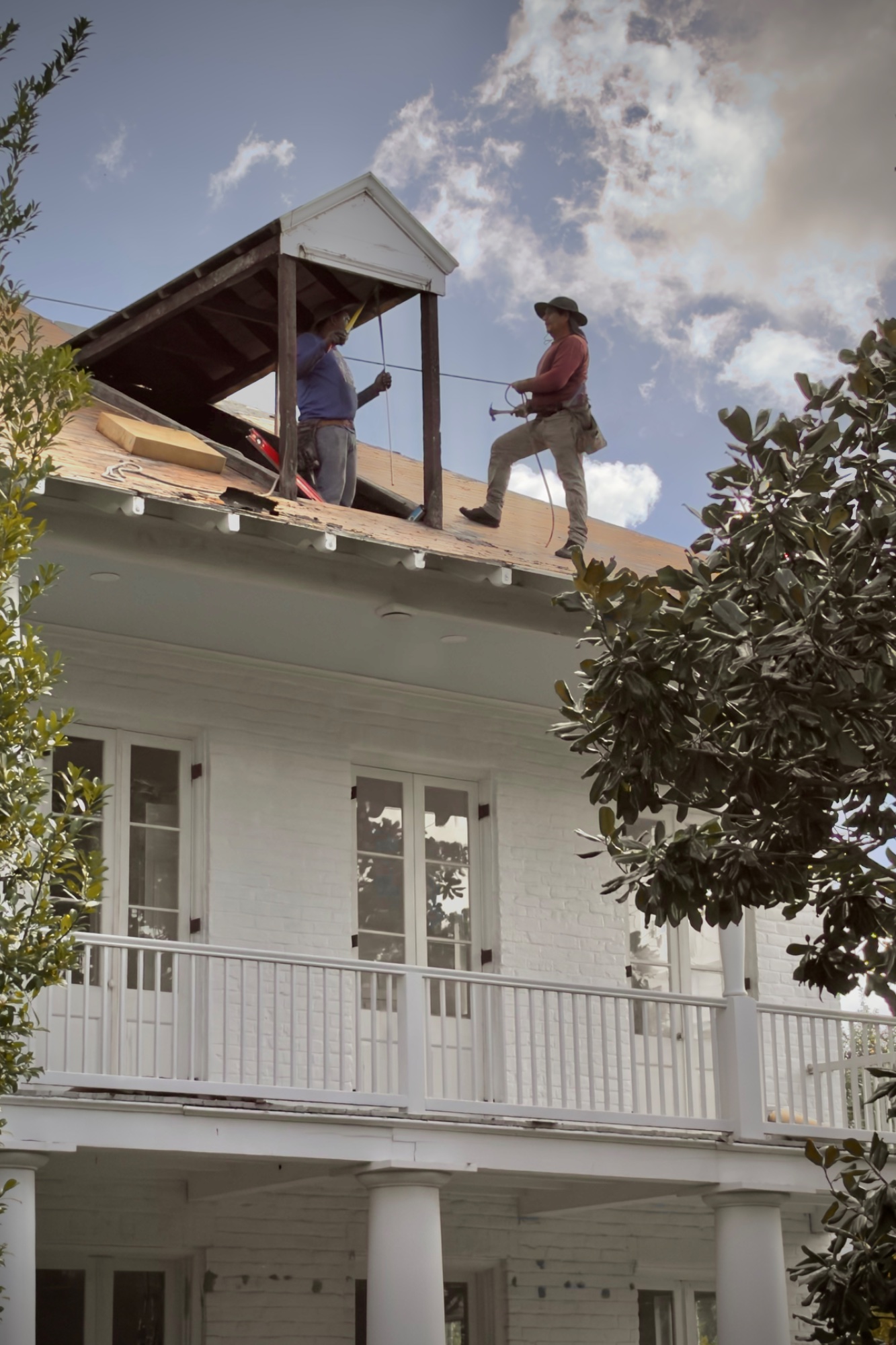 Roof Renovation — street photo by Les Zackler, scored 5.8/10 by REVIEWR's AI critique