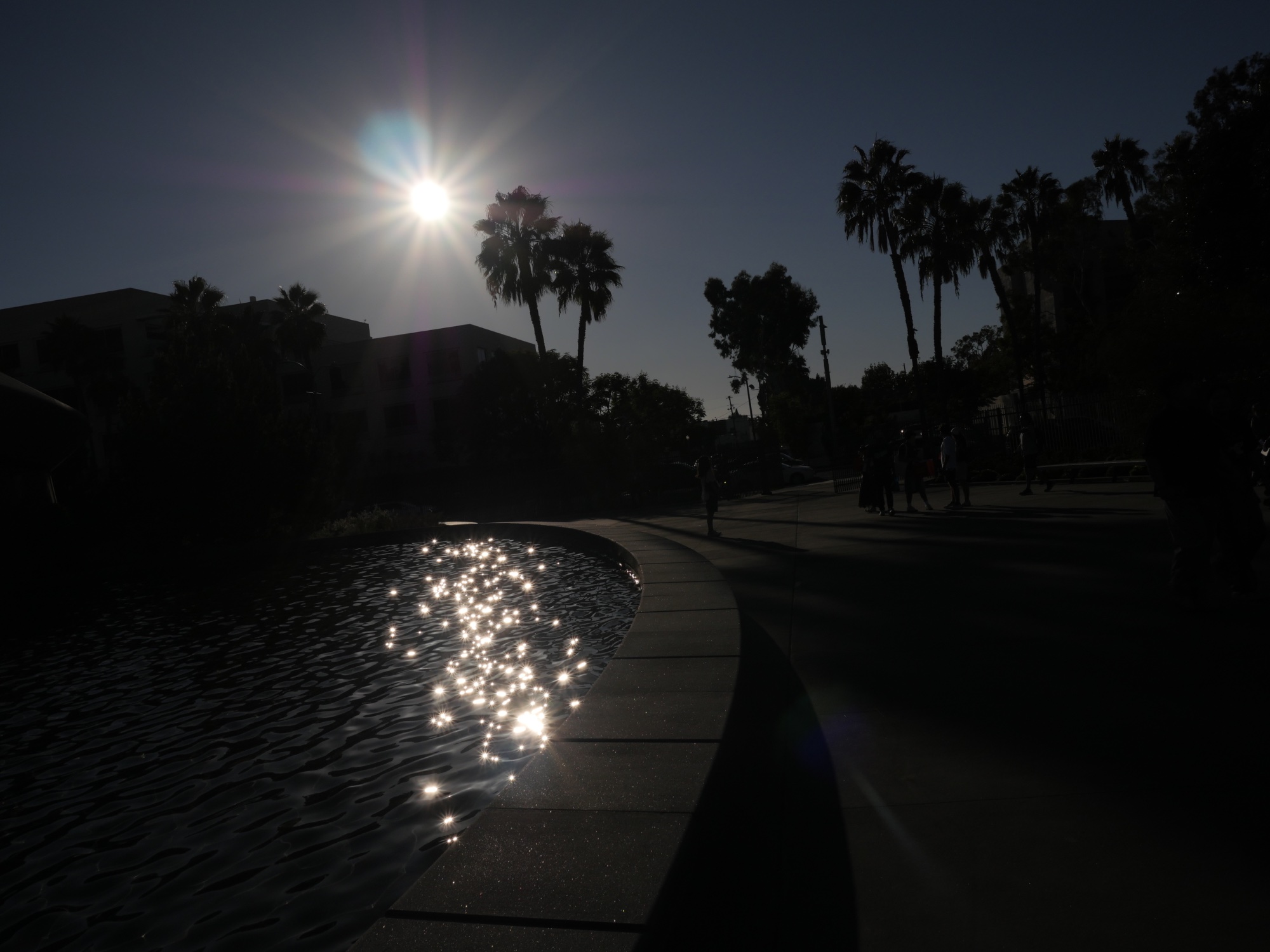 Sunburst and Shadows — street photo by Les Zackler, scored 4.6/10 by REVIEWR's AI critique