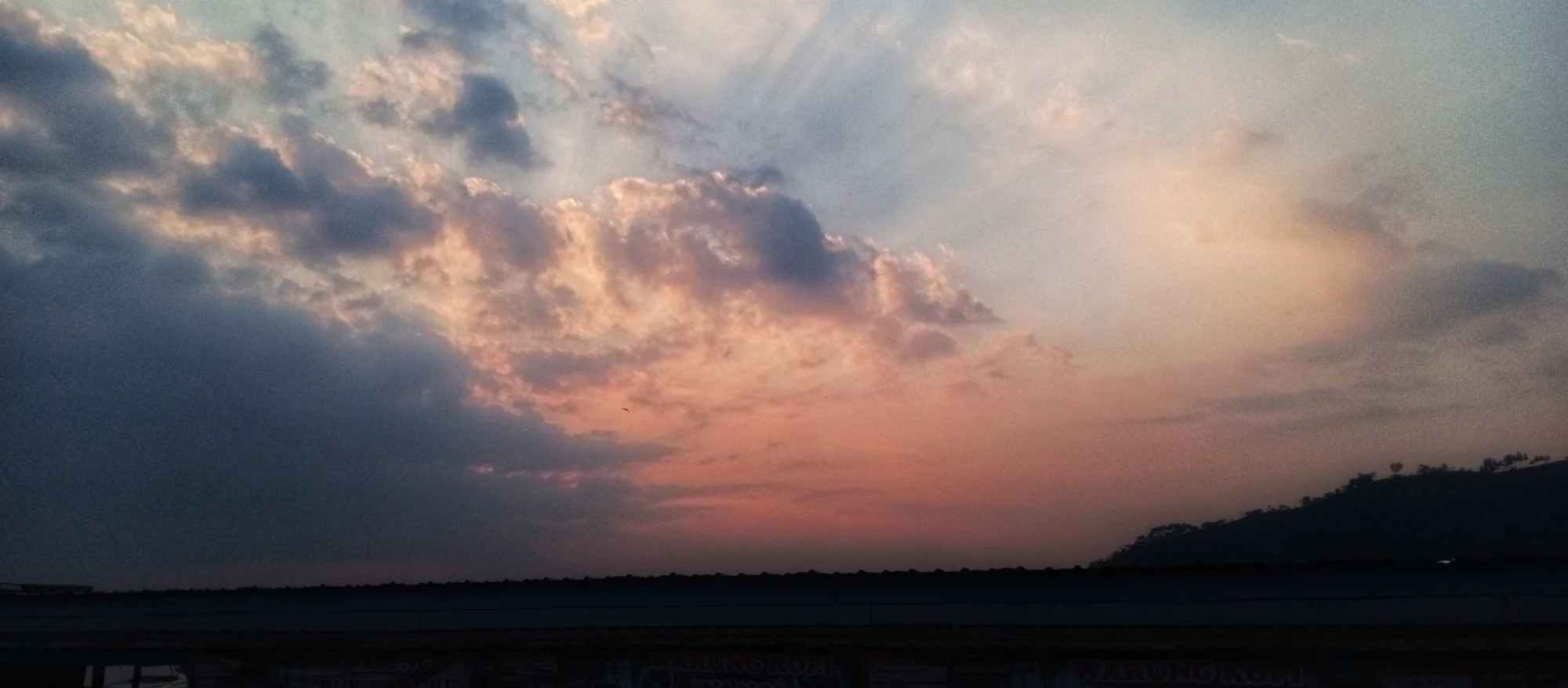 Pastel Sky Rays — landscape photo by Chandra, scored 6.1/10 by REVIEWR's AI critique